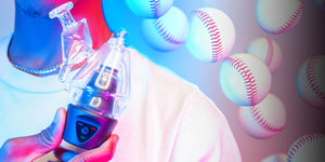 Man holding Sutra DBR Pro in front of blue and pink studio background with baseballs falling